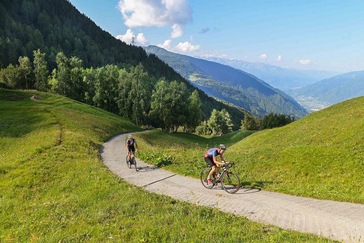 A rider reaching the summit of an scent during a Stelvio cycling holiday