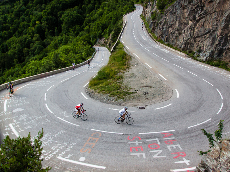 Cyclists negotiate a hairpin during the Alpe d'Huez Weekender