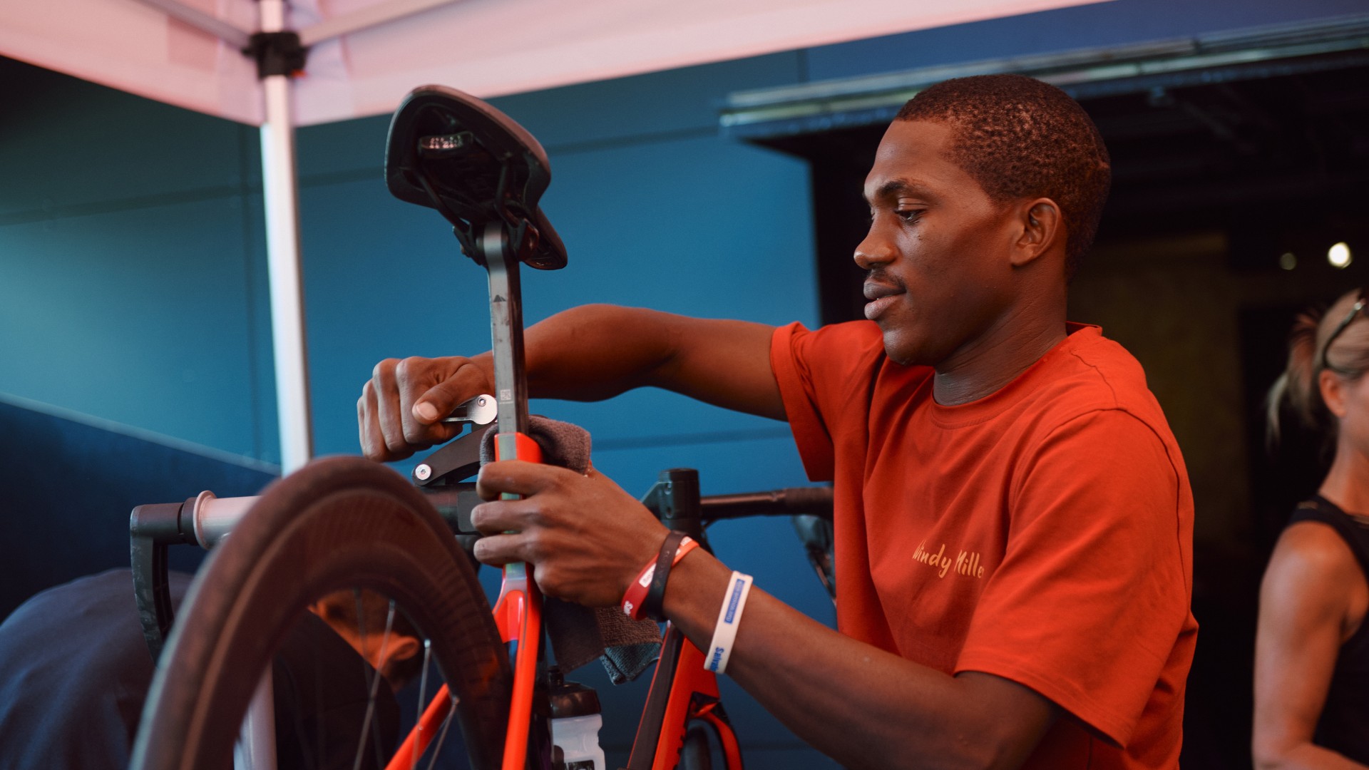 A mechanic fixes a bike during La Marmotte