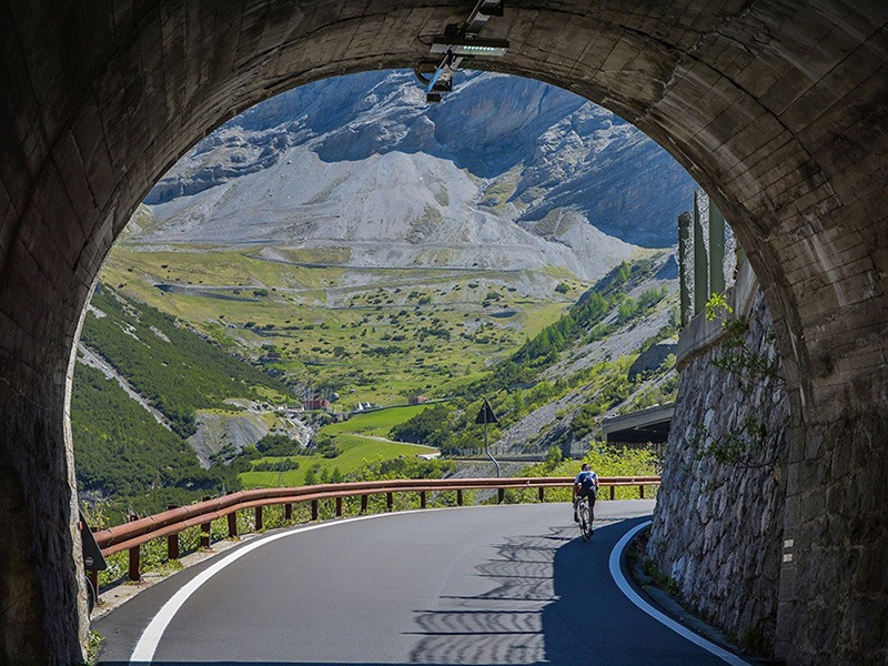 A cyclist emerges from a tunnel during a Weekender trip