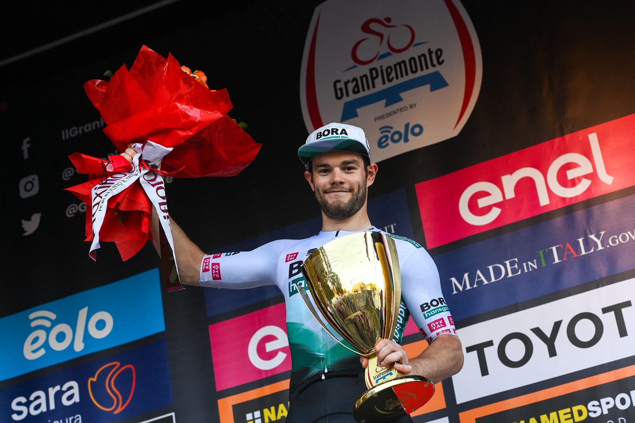 A rider celebrates having won the Gran Piemonte cycling race