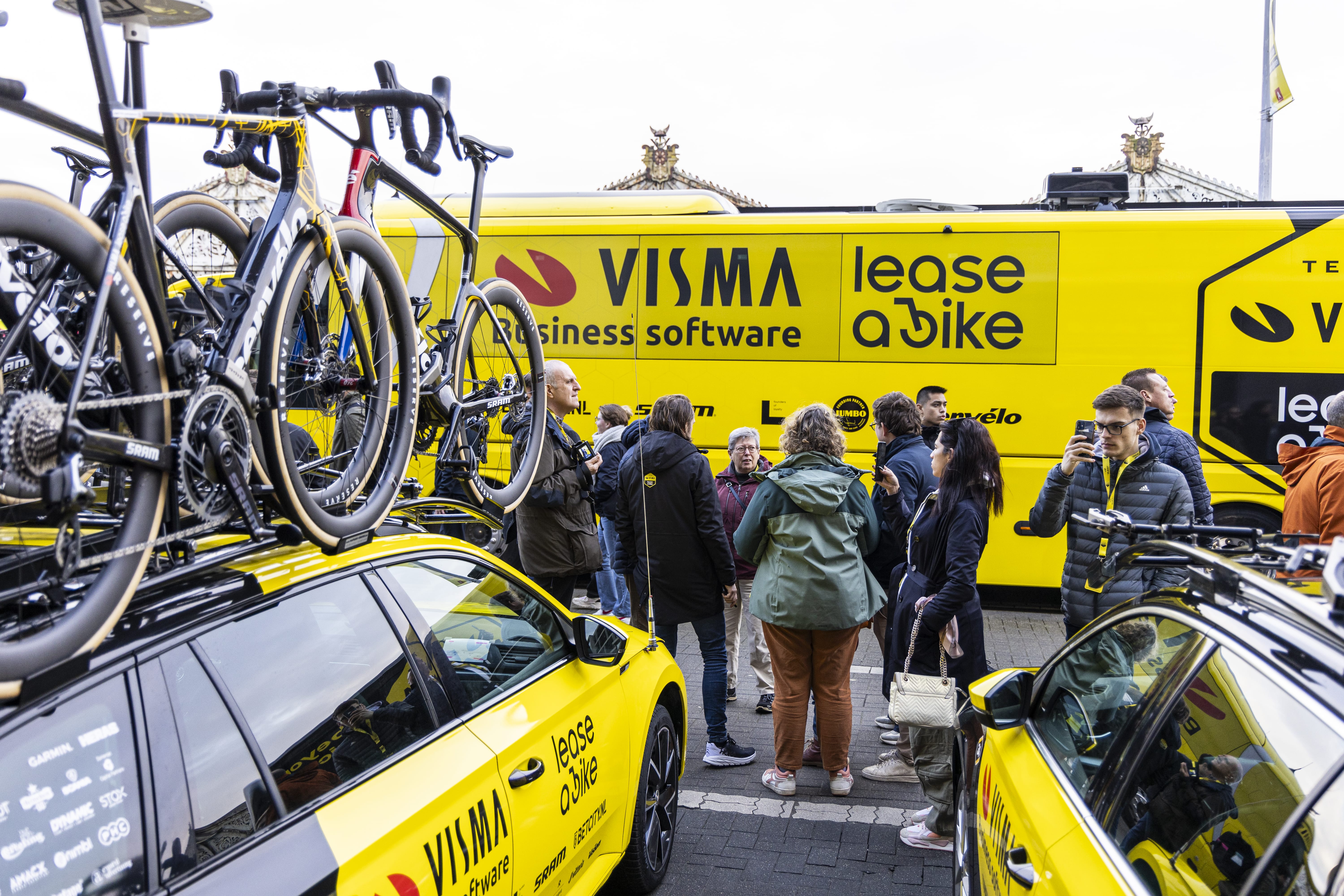 Team Visma Lease a Bike branded vehicles at the start line of the Tour de France