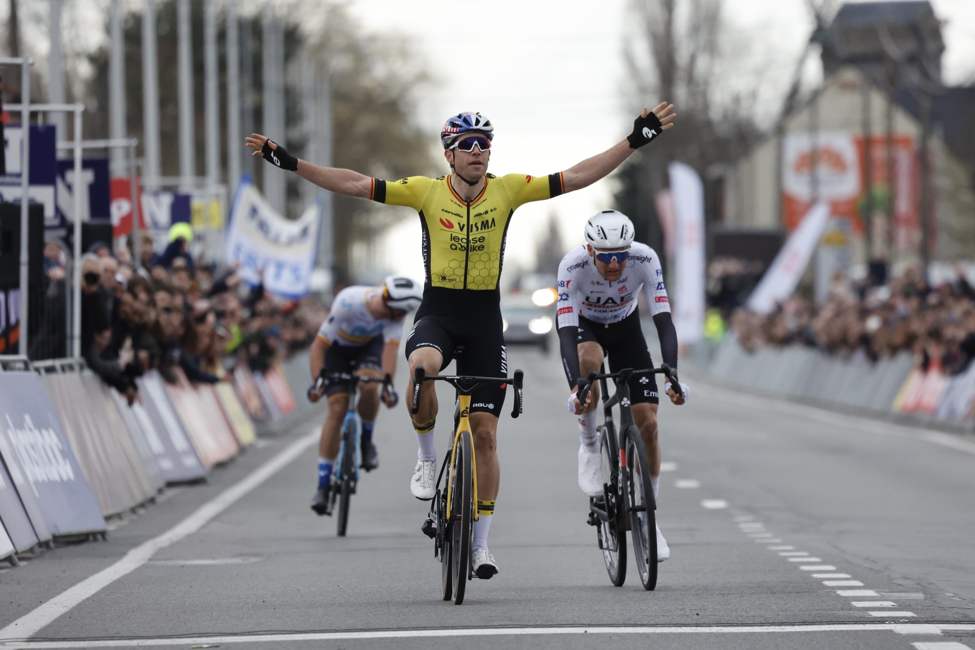 A Team Visma | Lease a Bike rider celebrates having just won Kuurne Brussels Kuurne - one of the many Spring Classics