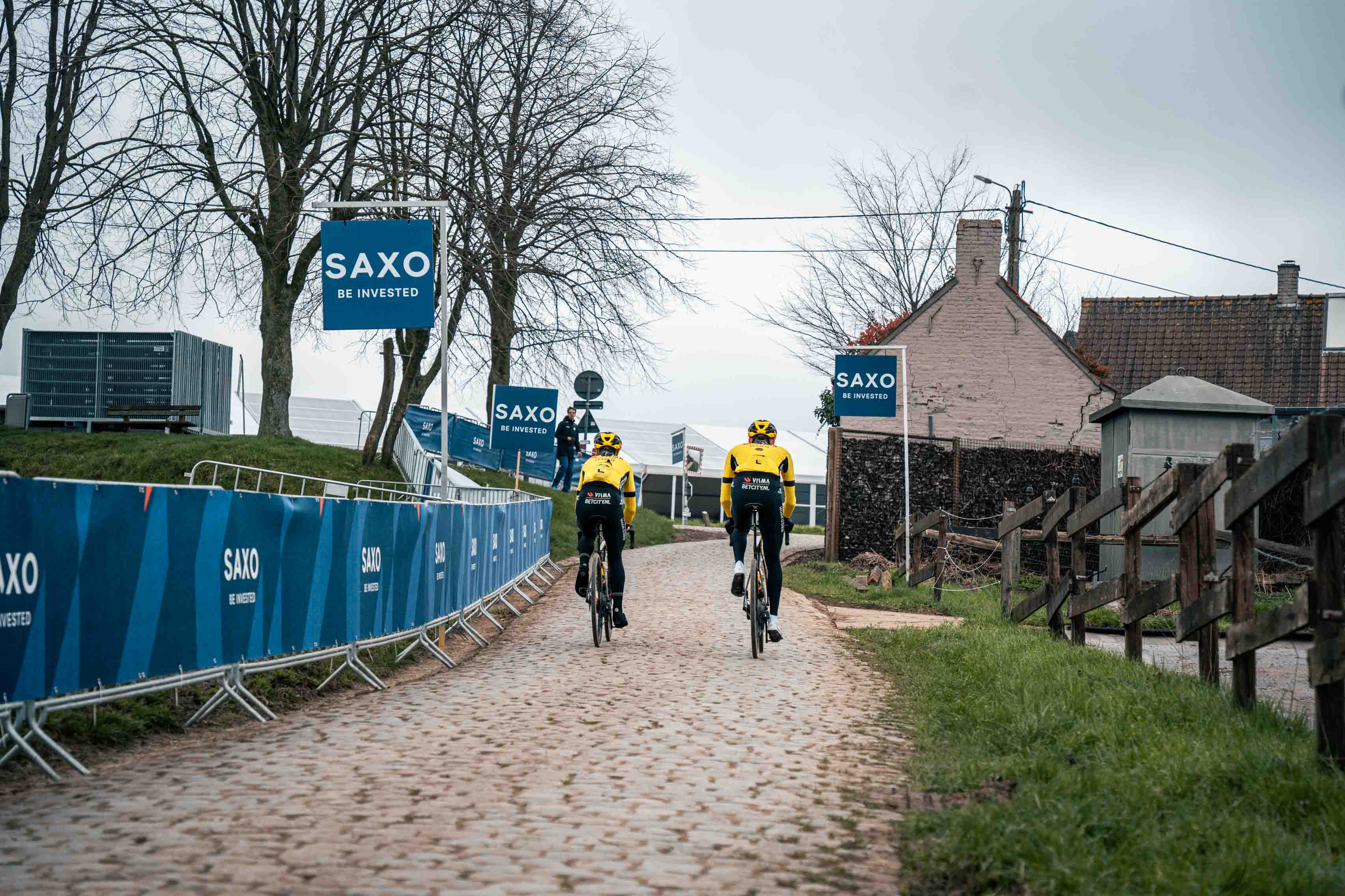 Team Visma | Lease a Bike riders passing along the cobbles during the E3 Saxo Classic