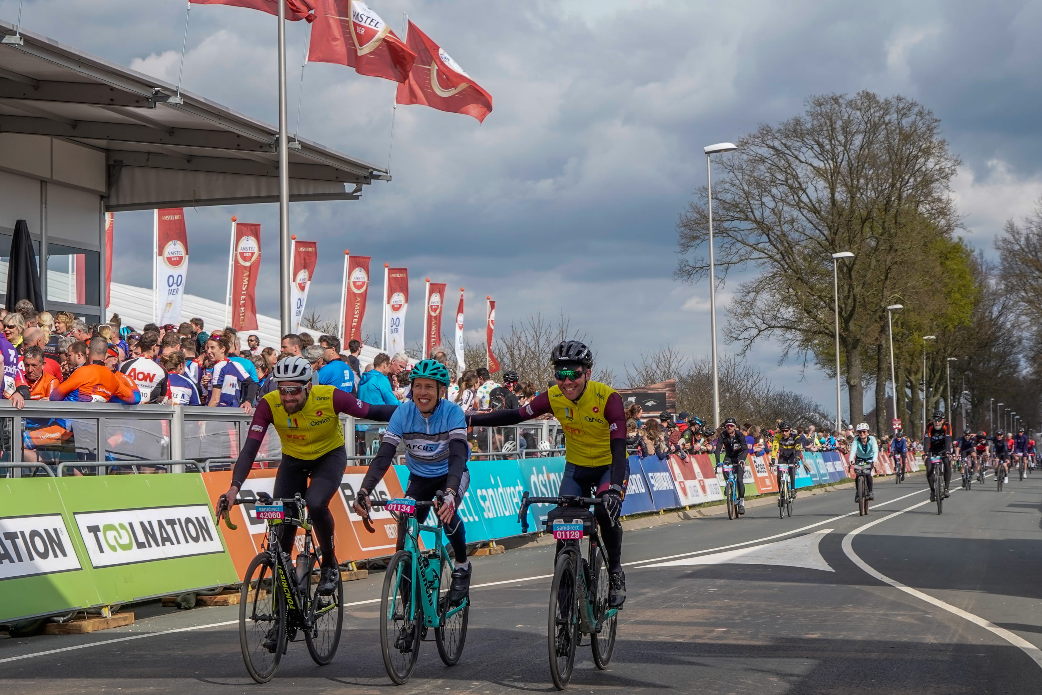 Riders cross the finish line during the Amstel Gold Race