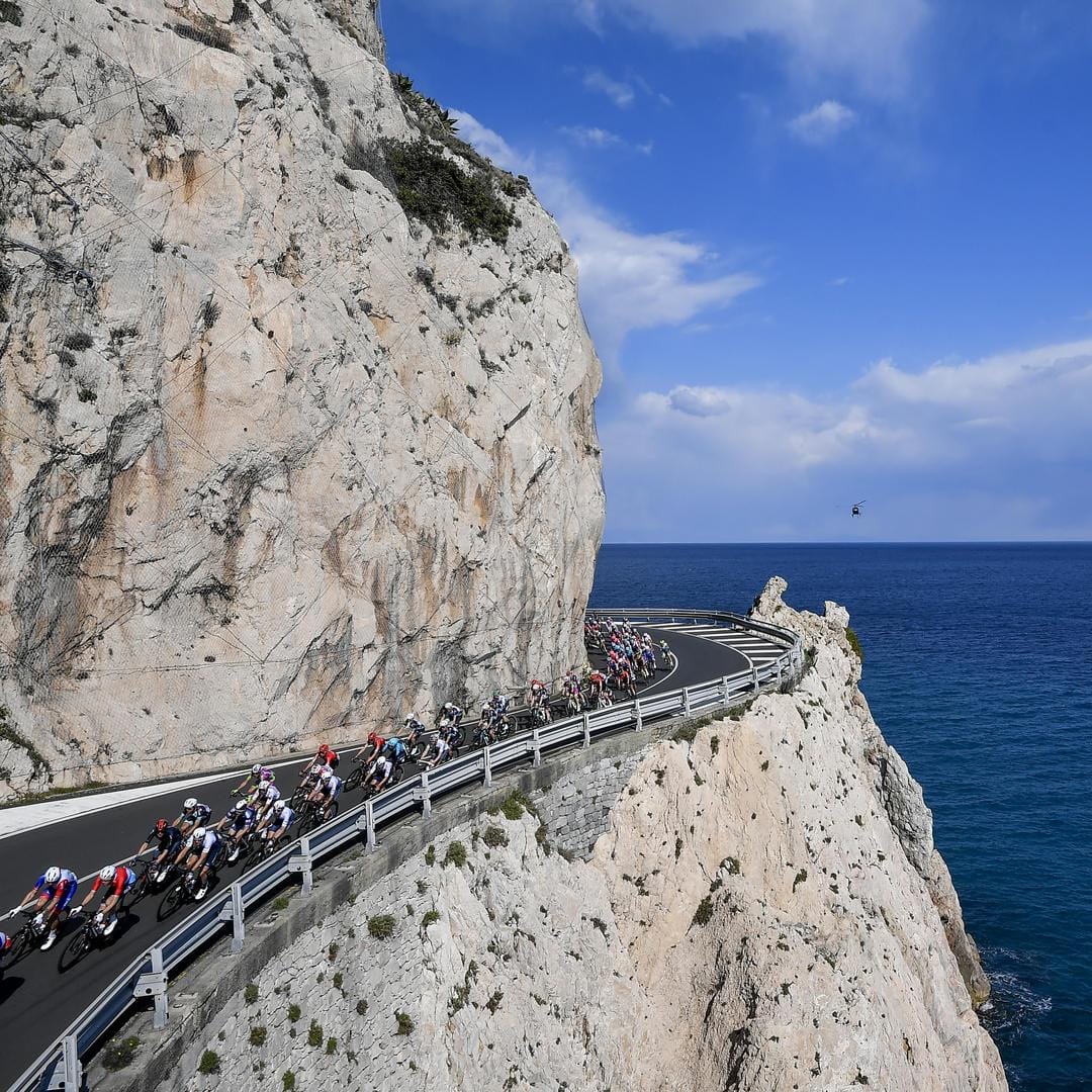 Riders hugging the coastline during the Milan San Remo cycling race