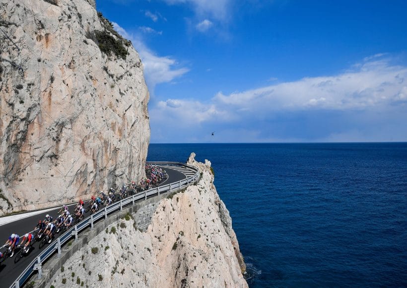 Riders round a cliffside hairpin bend during the Gran Fondo Milan-Sanremo