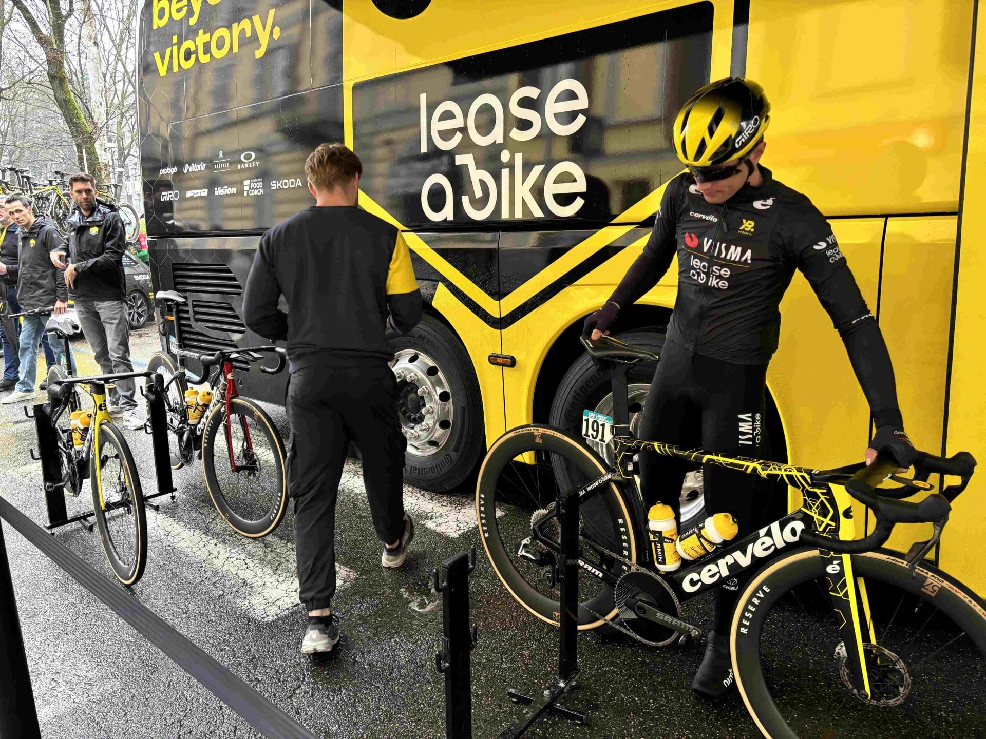 A Team Visma | Lease A Bike rider prepares their bike for the Milan-Sanremo race